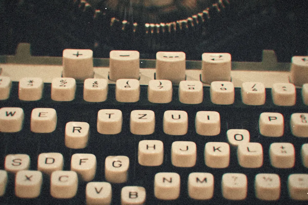 Close-up of the plain white keys on an old manual typewriter.