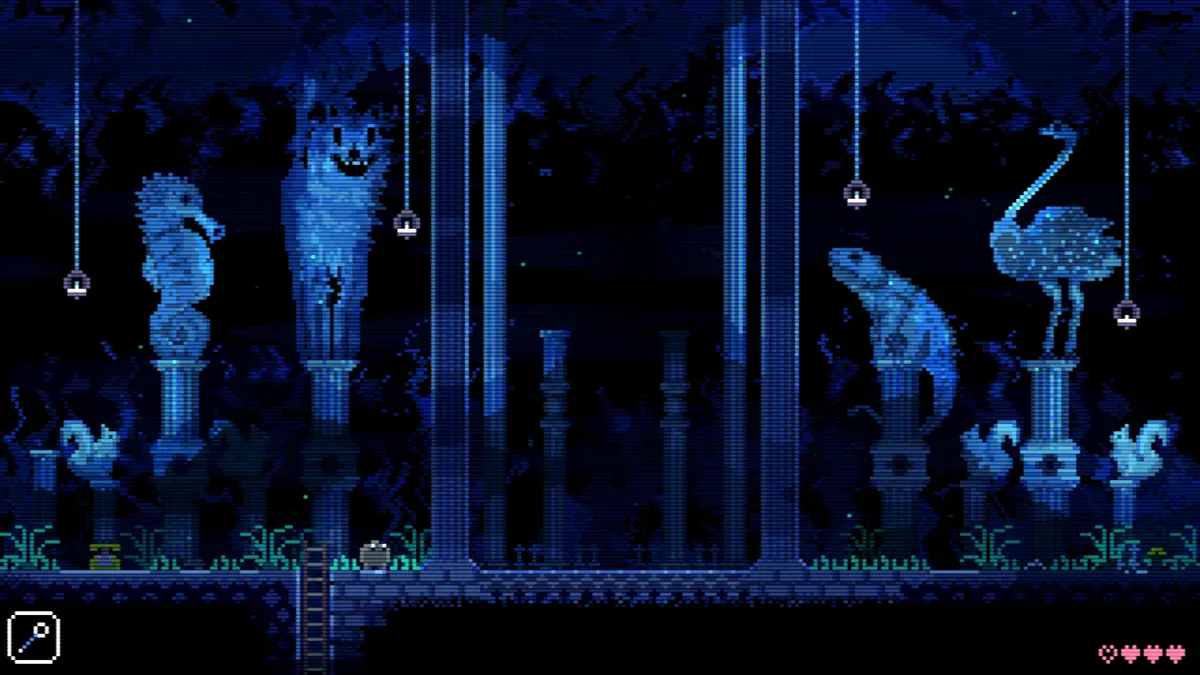 Glowing ghostly animal statues on pedestals in a dark blue hall in Animal Well.