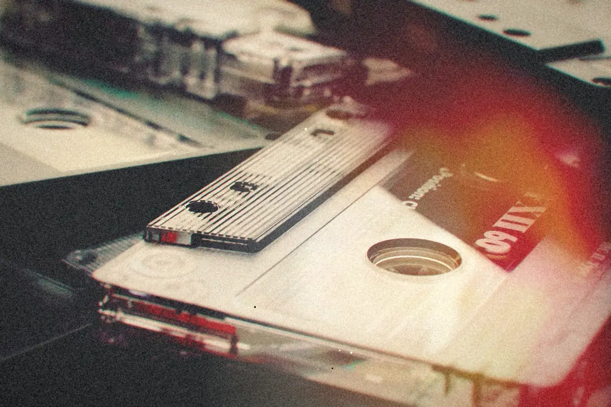 Clear audio cassette tapes overlapping in a close-up.