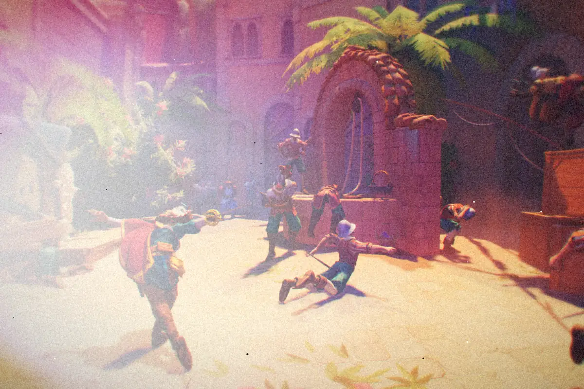 A swordfighter in a red cape battling guards in a sunny Spanish courtyard in En Garde!