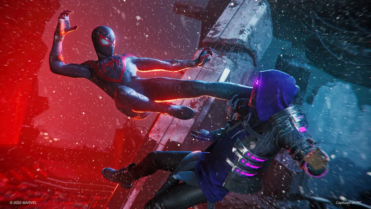Miles mid-leap in his black and red suit, kicking a purple-hooded enemy against a glowing red city backdrop.