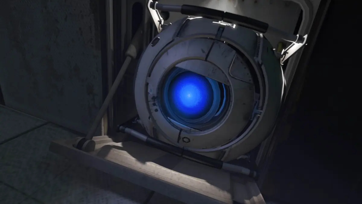 Wheatley, a round robot with a single blue eye, hanging from his rail.