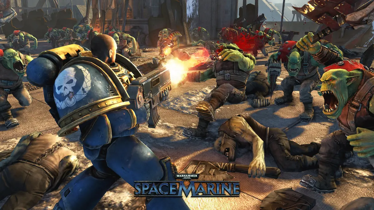 A blue-armored Space Marine firing into a crowd of charging orks in a ruined street.